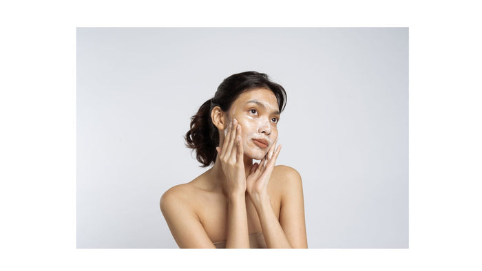 woman cleansing face